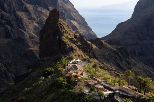 Aerial view of Masca village nestled in a dramatic mountain gorge, Tenerife, Canary Islands